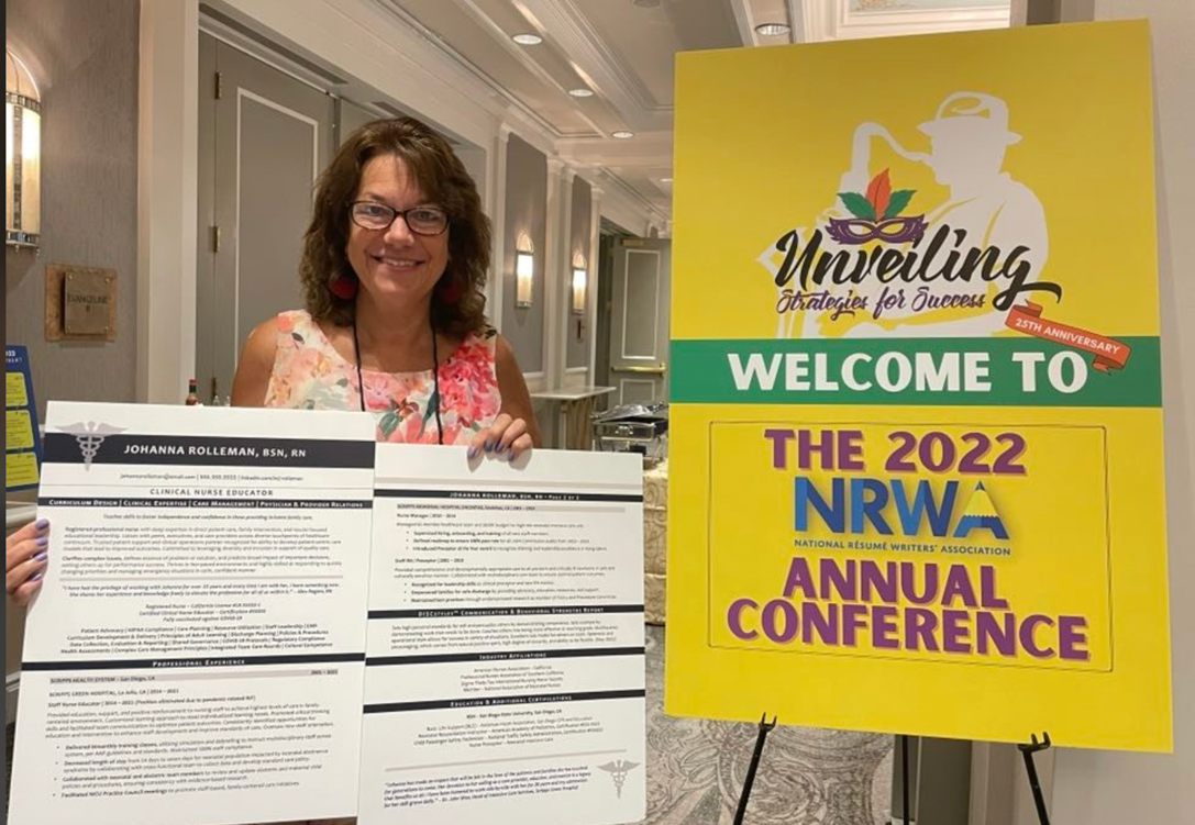 2022 ROAR Award Winner Cathy Lanzalaco poses with her resume sample at the 2022 Conference