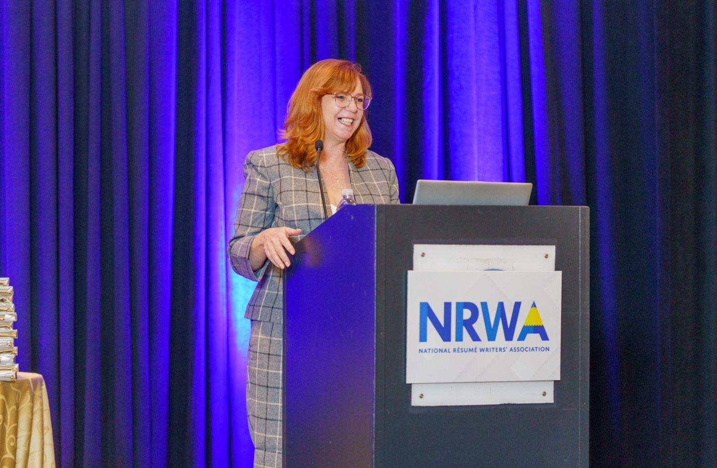 NRWA President Sara Timm presenting at the podium at the 2022 Conference in New Orleans